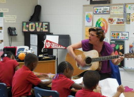 teacher playing guitar 